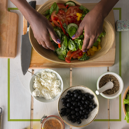 African American woman preparing a healthy meal